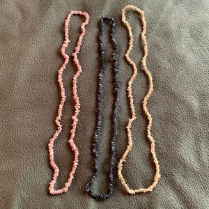Set of 3 necklaces. Pink, blue and yellow. Approximately 15 inches long